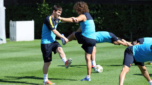 Puyol y Messi, durante el entrenamiento de este domingo / FOTO: MIGUEL RUIZ-FCB