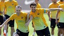 Iniesta and Cesc in a training session