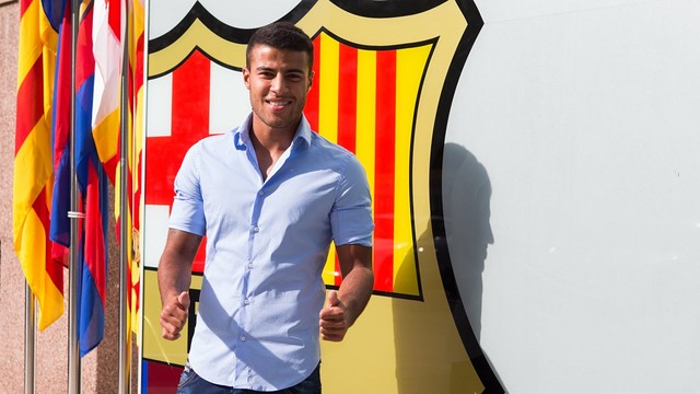 Rafinha by the club crest outside the offices