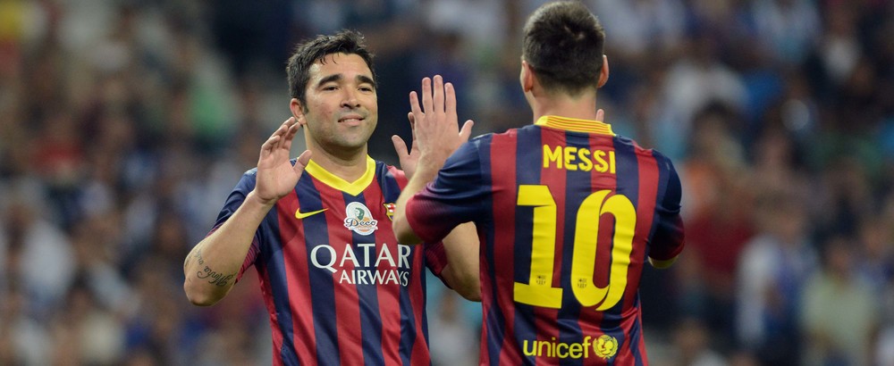 Leo Messi and Deco celebrate a goal scored by the latter